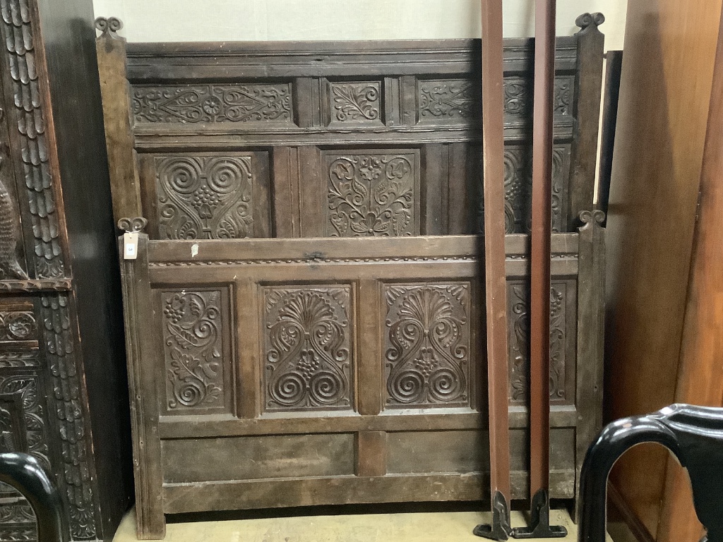 A carved oak double bedframe made from old timber, width 136cm height 139cm